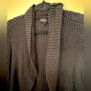 Soft oversized black sweater with some silver glitz thread. Good condition.